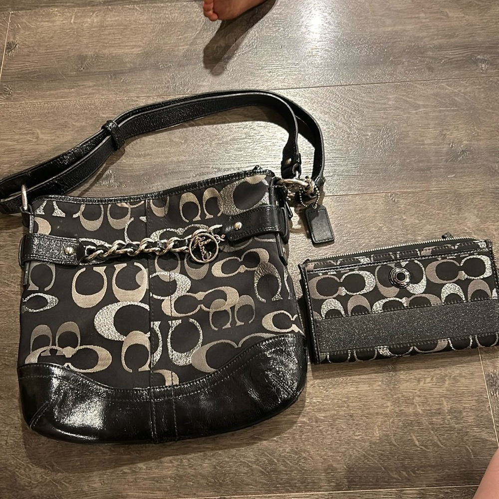 Coach black and silver and the wallet is a little messed up